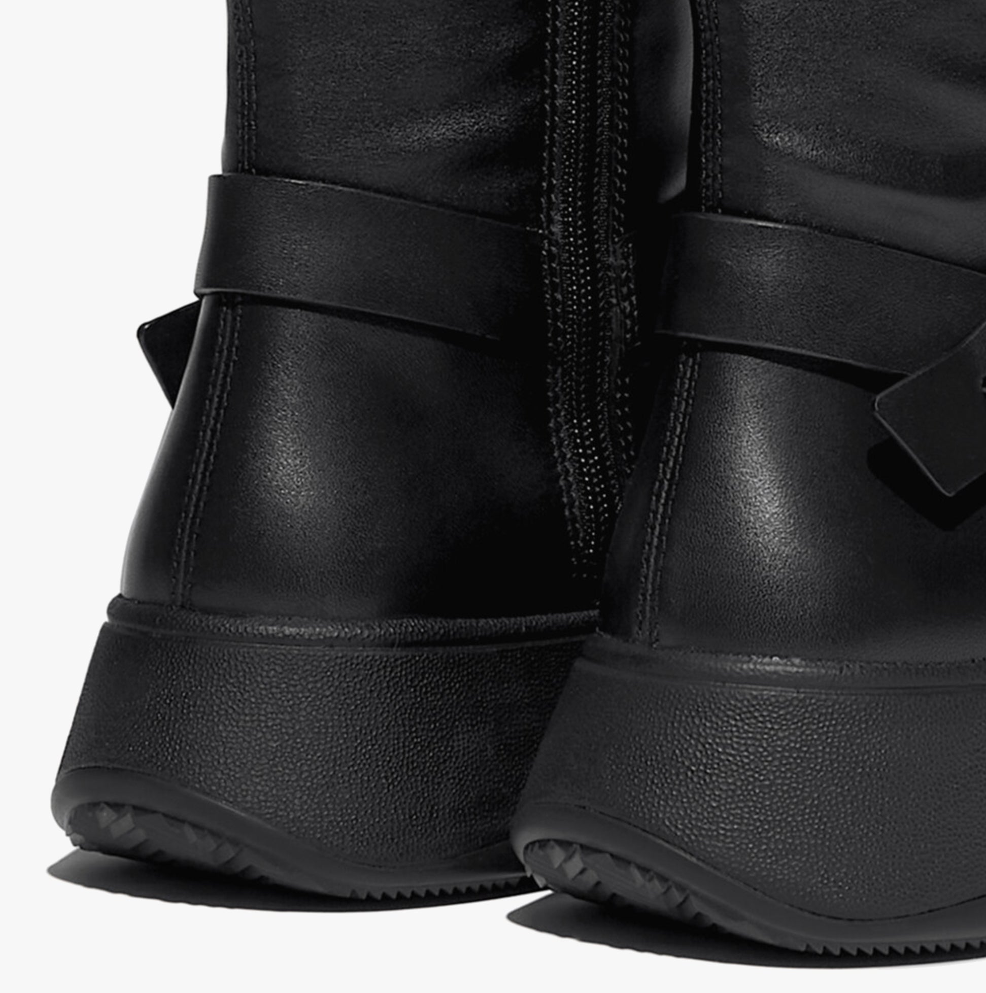 FitFlop F-MODE Womens Boots Black detail view of the heel and side, showcasing leather upper and platform sole.