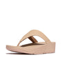 Side view of FitFlop LULU LEATHER Womens Toe Post Sandals Sandy Beige with a low platform heel and slip-on design.