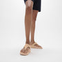 FitFlop LULU LEATHER Womens Toe Post Sandals Sandy Beige side view on a model's feet showing arch support and comfort.