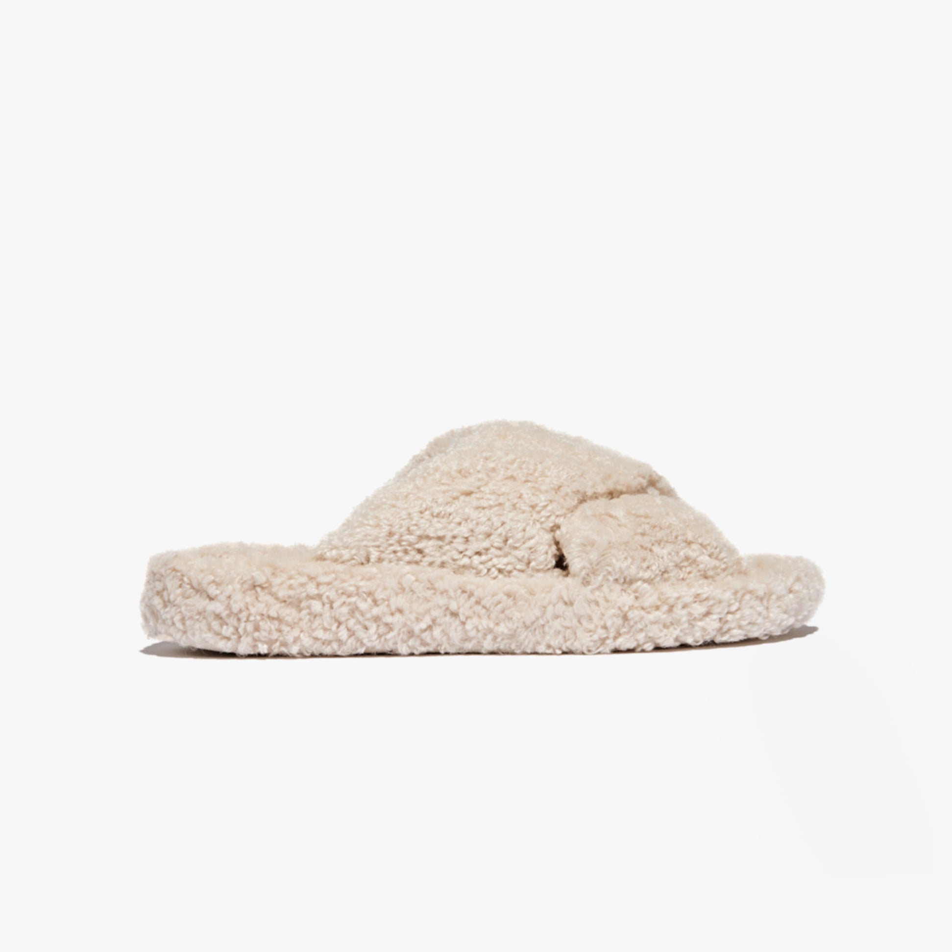 FitFlop iQUSHION D-LUXE Womens Cross Slides Milk Ice side view showing soft polyester upper and flat rubber sole