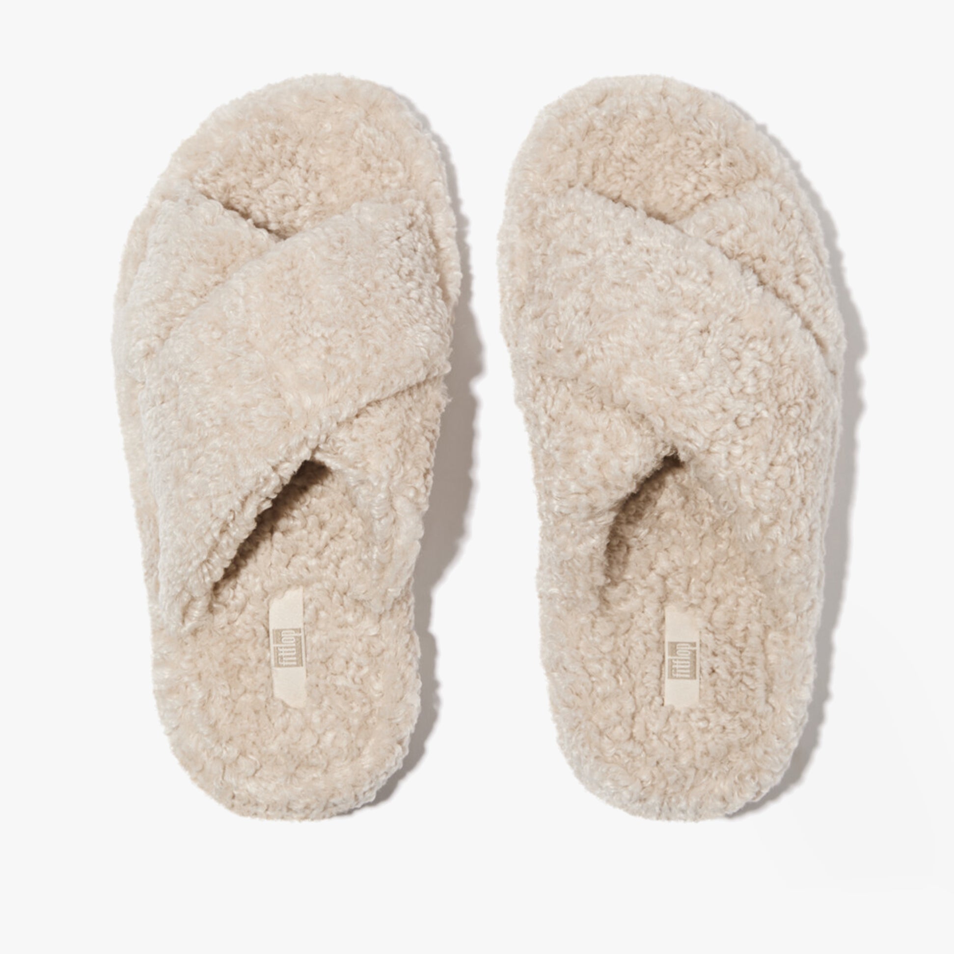 FitFlop iQUSHION D-LUXE Womens Cross Slides Milk Ice top view showing soft cross straps and cozy material.