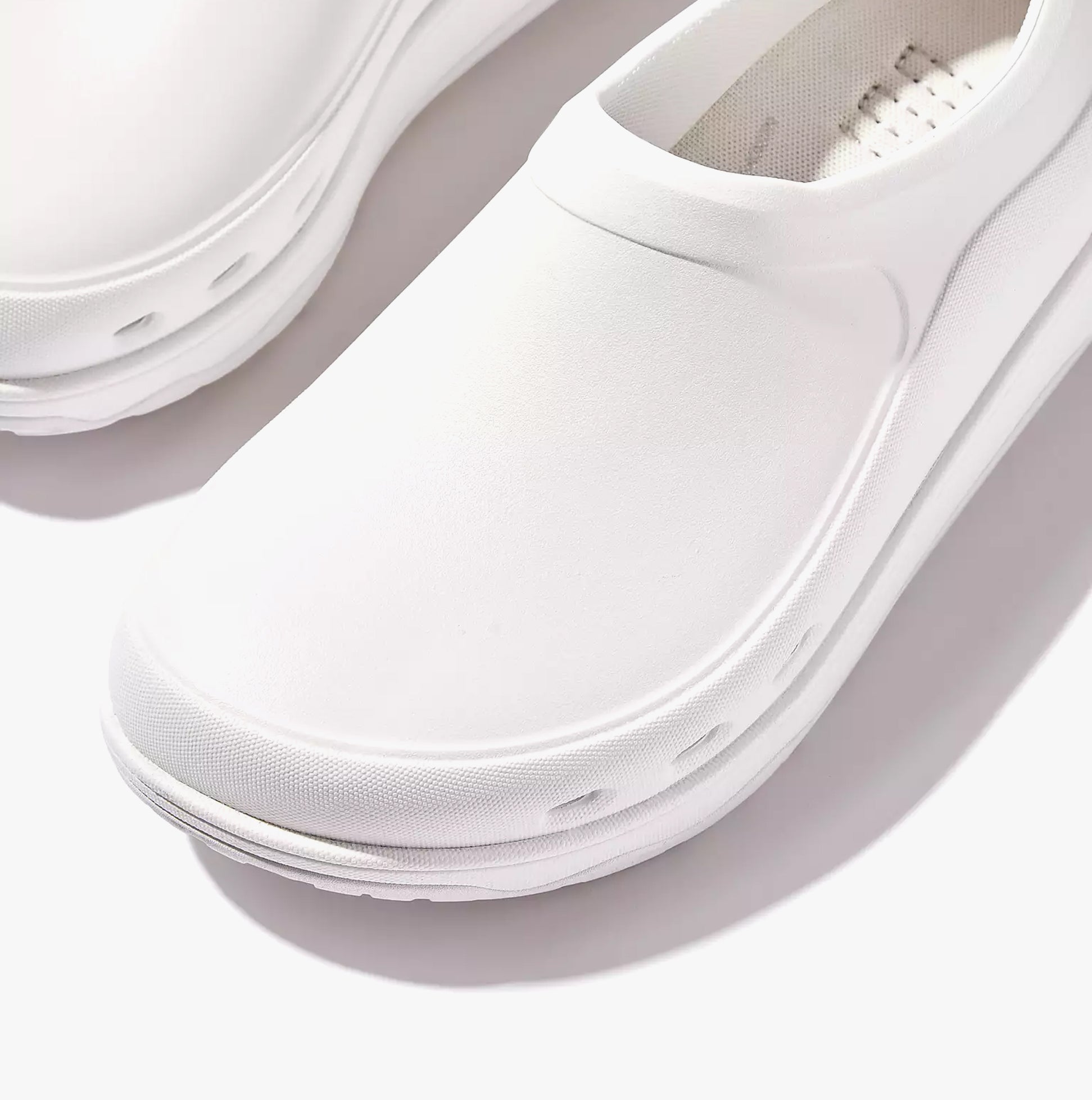 FitFlop WORK HIGH-PERFORMACE Womens Clogs Urban White detail view showcasing the smooth EVA upper and low-top design.