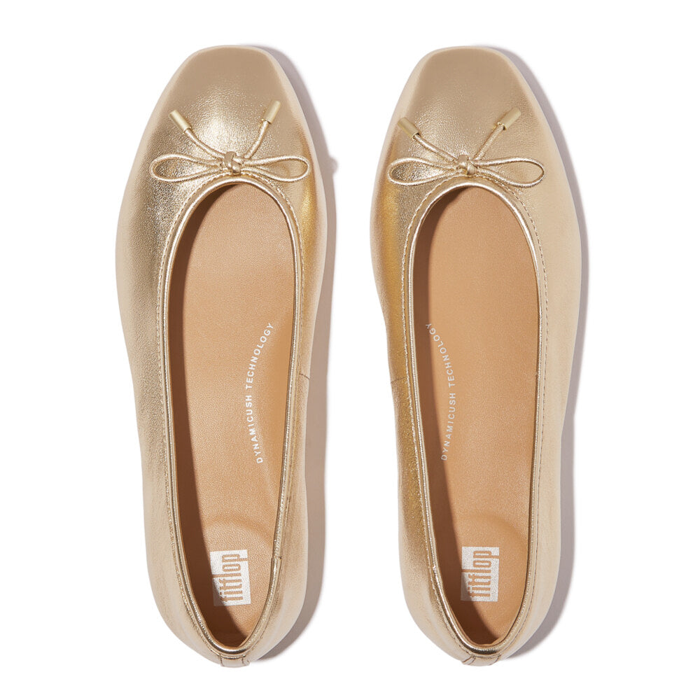 FitFlop DELICATO BOW SOFT Womens Ballet Flats Platino top view showing gold leather and bow detail.