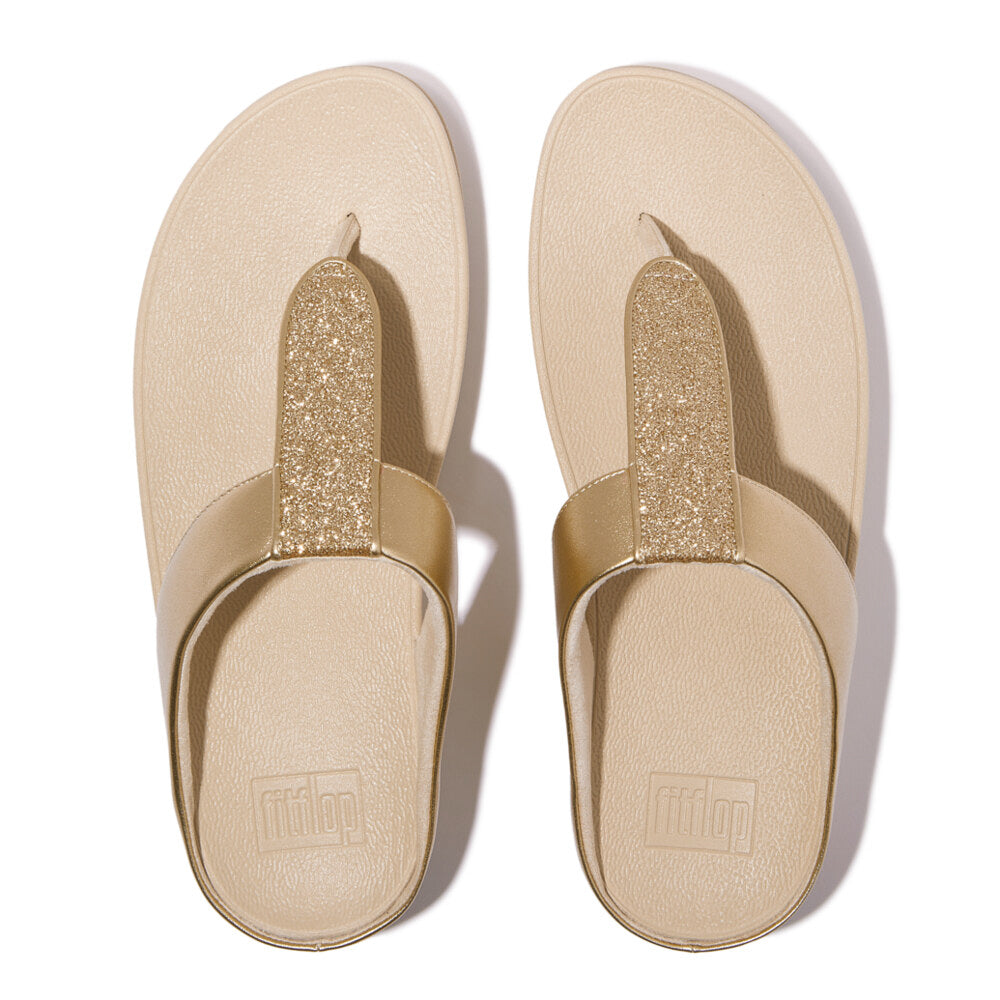 FitFlop FINO GLITTERDUST METALLIC Womens Toe Post Sandals Platino top view showcasing slip-on design and glitter accent.