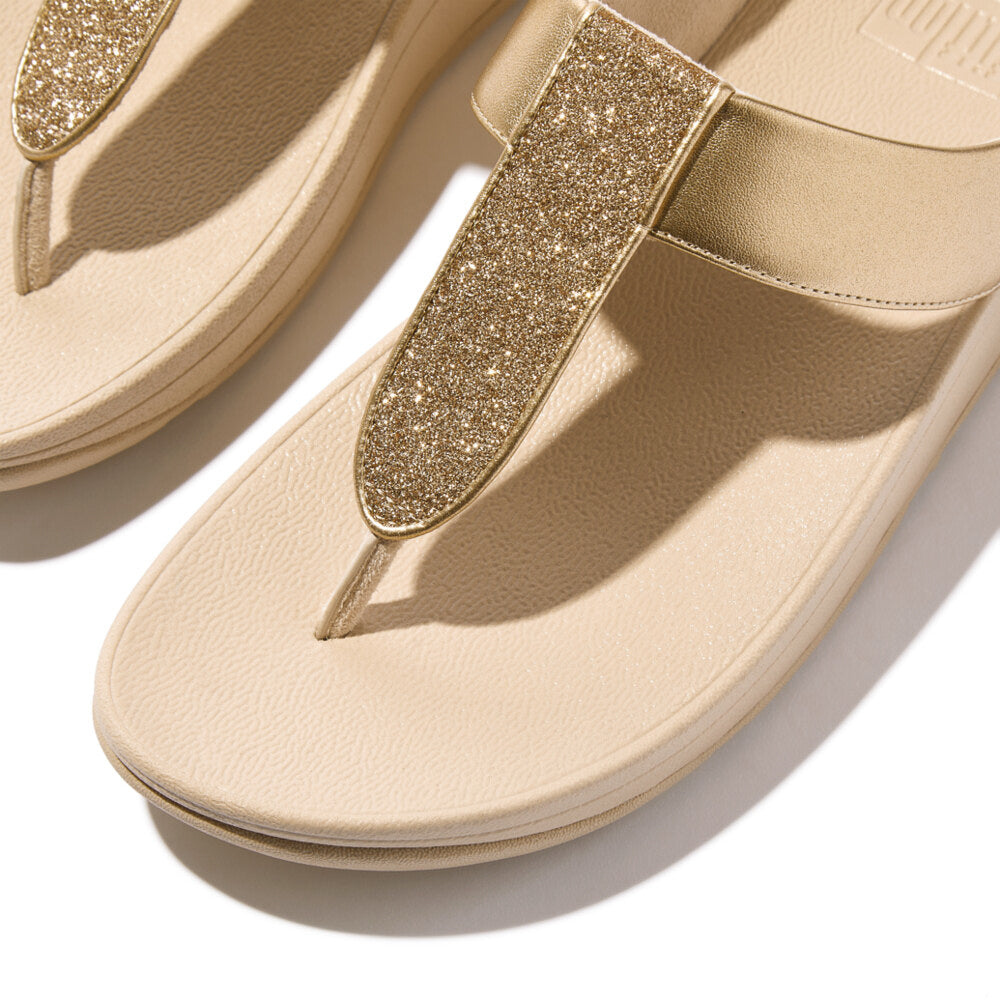FitFlop FINO GLITTERDUST METALLIC Womens Toe Post Sandals Platino top detail view showcasing glitter strap and comfortable sole.