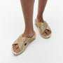 FitFlop LULU GLITTERDUST Womens Slides Platino side view showing the glittery slip-on design and wedge heel.