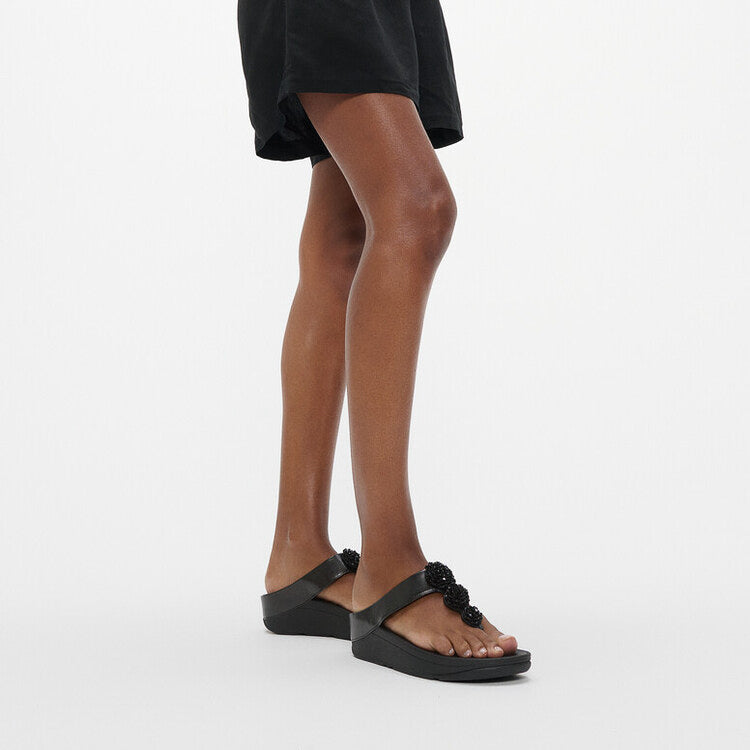 FitFlop FINO BEADIE-BUTTON Womens Toe Post Sandals Metallic Black side view on model foot