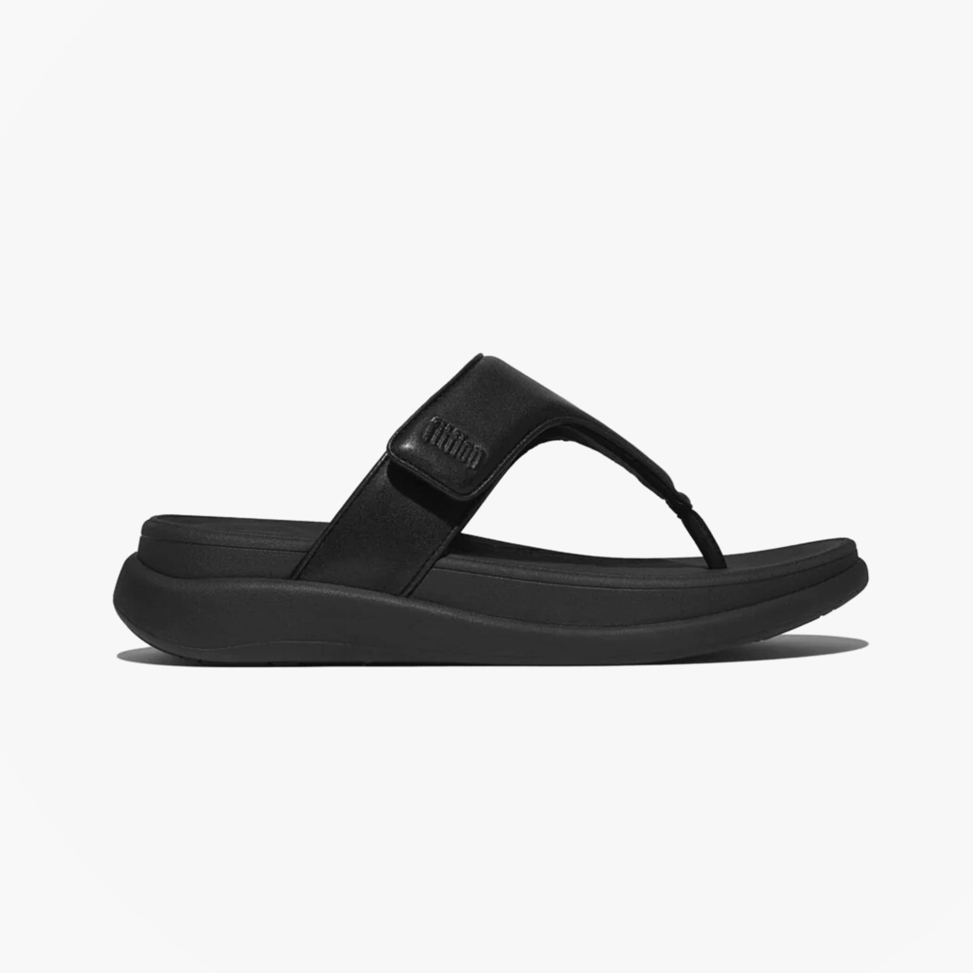 FitFlop F-MODE GO Womens Toe Post Sandals All Black side view with slip-on design and comfortable rubber sole.