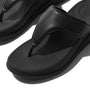 FitFlop F-MODE GO Womens Toe Post Sandals All Black, close-up detail view of black leather toe post sandals.