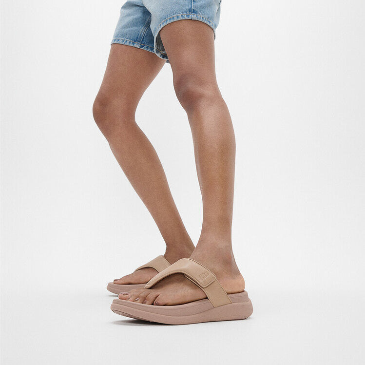 FitFlop F-MODE GO Womens Toe Post Sandals Classic Beige side view on model's feet, showcasing comfort and stylish design.