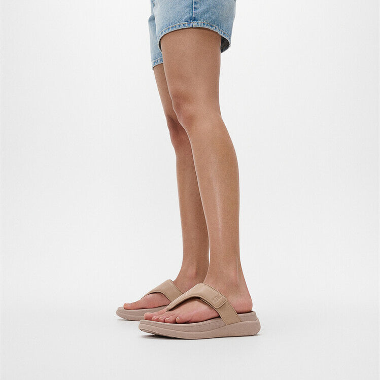 FitFlop F-MODE GO Womens Toe Post Sandals Classic Beige side view on model with denim shorts.