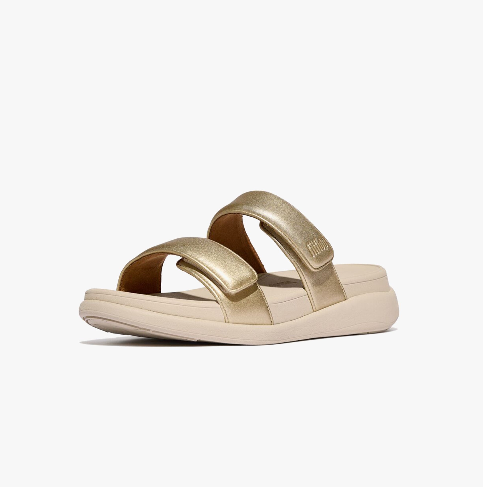 FitFlop F-MODE GO Womens Slides Platino side view showing the gold leather upper and comfortable slip-on design.