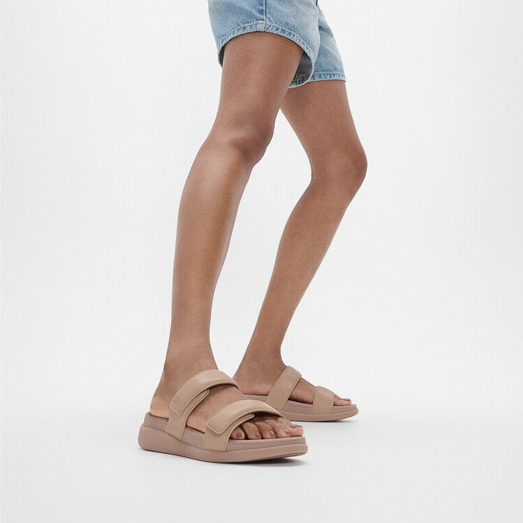 FitFlop F-MODE GO Womens Slides Classic Beige side view on model wearing denim shorts