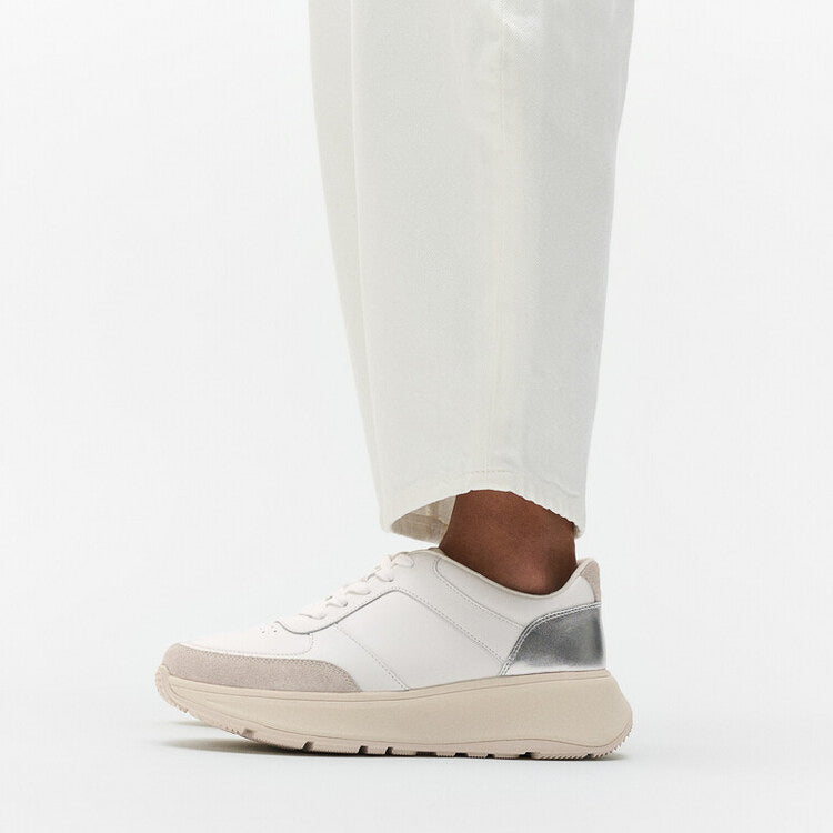 FitFlop F-MODE LEATHER Womens Trainers Urban White/Silver side view on model's foot with cream pants.