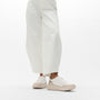 FitFlop F-MODE LEATHER Womens Trainers Urban White/Platino side view on model's feet with wide pants.