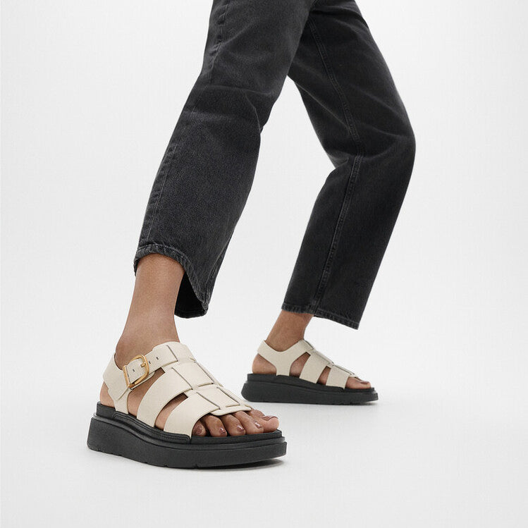 FitFlop GEN-FF LEATHER Womens Fisherman Sandals Paris Beige side view on model with black jeans.