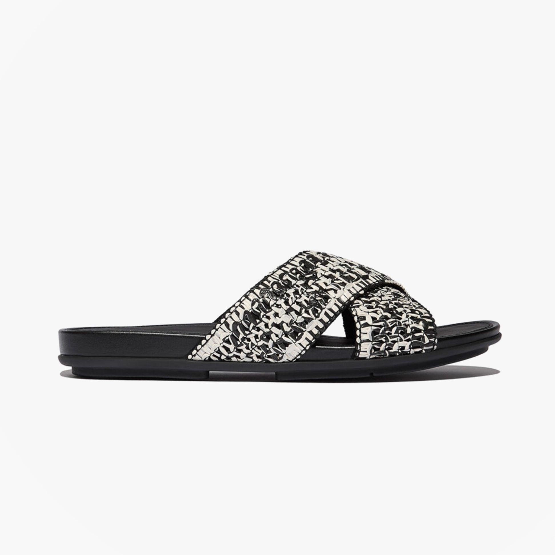 FitFlop GRACIE WOVEN Womens Slides Black/Ivory Mix side view showcasing stylish woven design and slip-on comfort.
