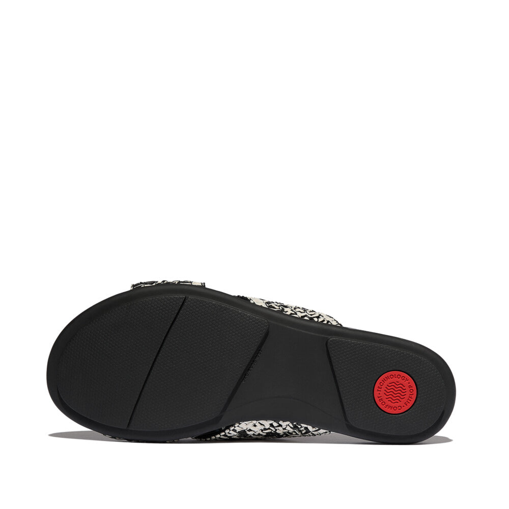 FitFlop GRACIE WOVEN Womens Slides Black/Ivory Mix bottom view, showcasing rubber sole design and logo detail.