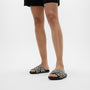 FitFlop GRACIE WOVEN Womens Slides Black/Ivory Mix front view on model's feet showcasing comfort and style.
