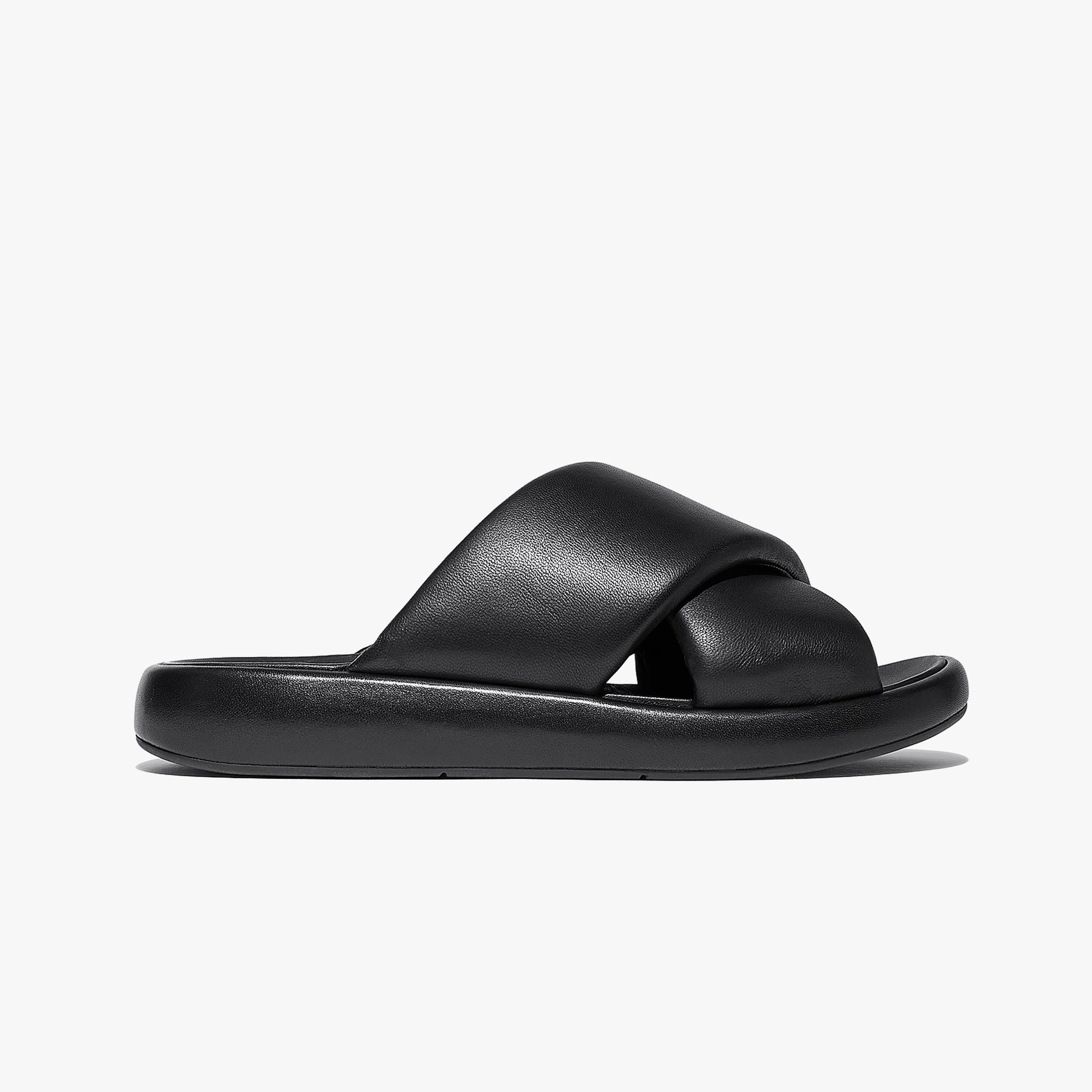 FitFlop iQUSHION D-LUXE Womens Slides All Black side view featuring leather upper and rubber sole.