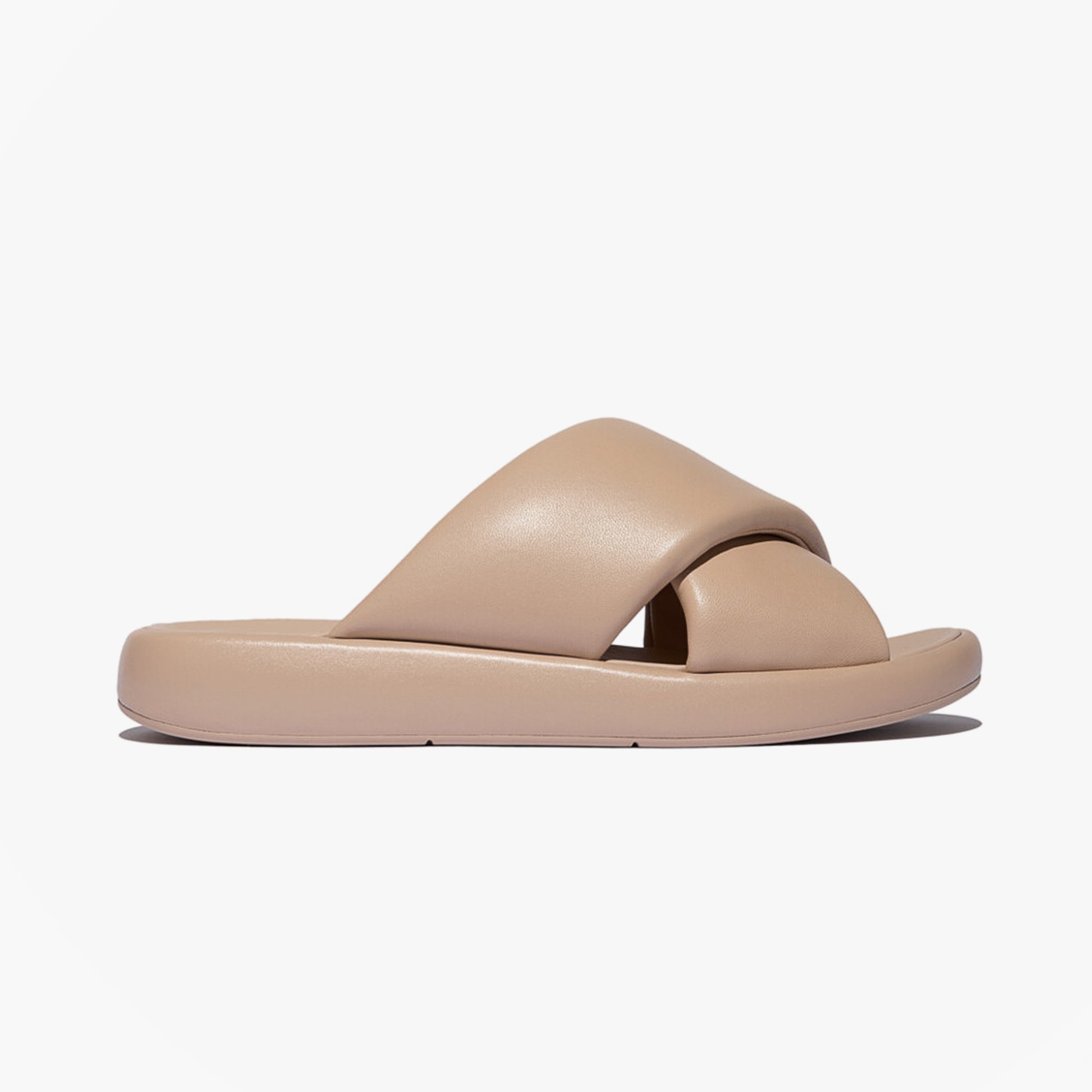 FitFlop iQUSHION D-LUXE Womens Slides Classic Beige side view with leather upper and rubber sole.