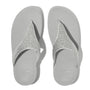 FitFlop LULU CRYSTAL-MIX Womens Toe Post Sandals Silver top view displaying the glittering toe post design on a grey sole.
