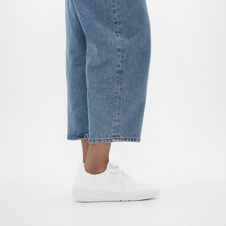 FitFlop SUPER-Q KNIT Womens Trainers Urban White side view worn with blue denim.