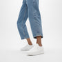 FitFlop SUPER-Q KNIT Womens Trainers Urban White side view worn with cropped jeans, showcasing comfort and style.