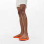 FitFlop IQUSHION SPARKLE Womens Toe Post Sandals Pop Orange side view worn on feet, showcasing comfort and style.