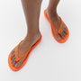 FitFlop IQUSHION SPARKLE Womens Toe Post Sandals Pop Orange side view on model's feet with bright orange color and comfortable design.