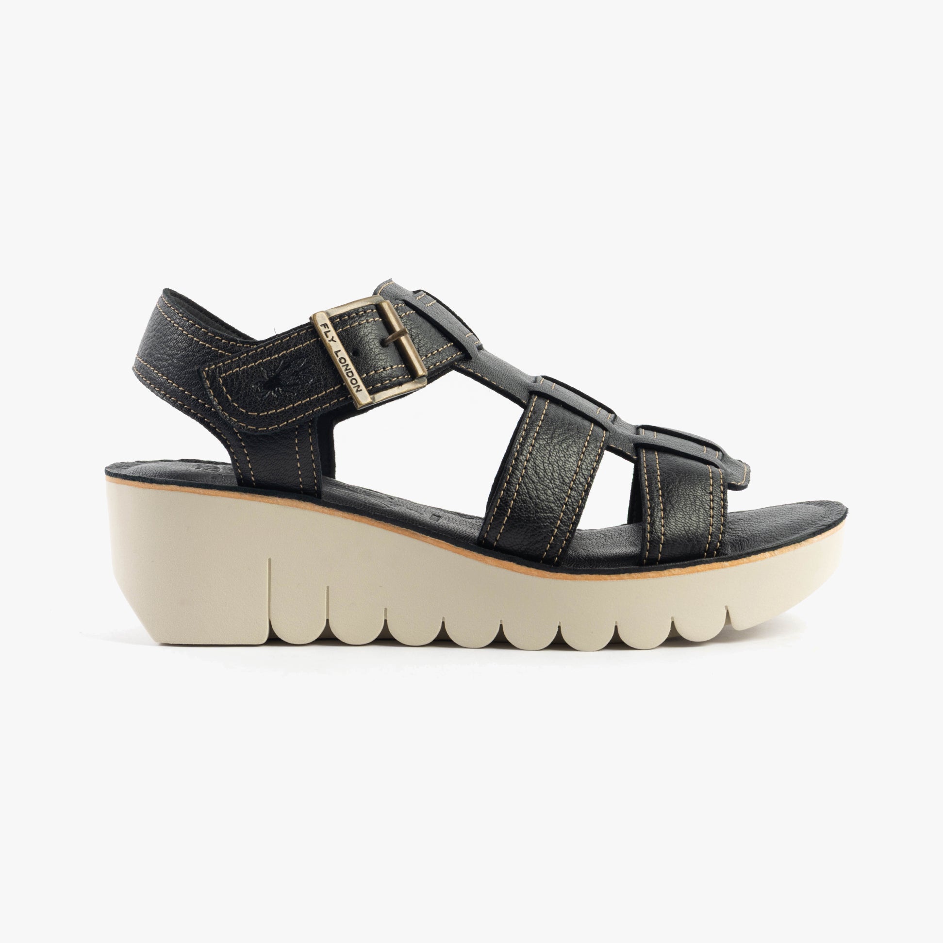 Fly London YUDD236FLY Womens Sandals Black side view showcasing leather upper, wedge heel, and buckle closure.