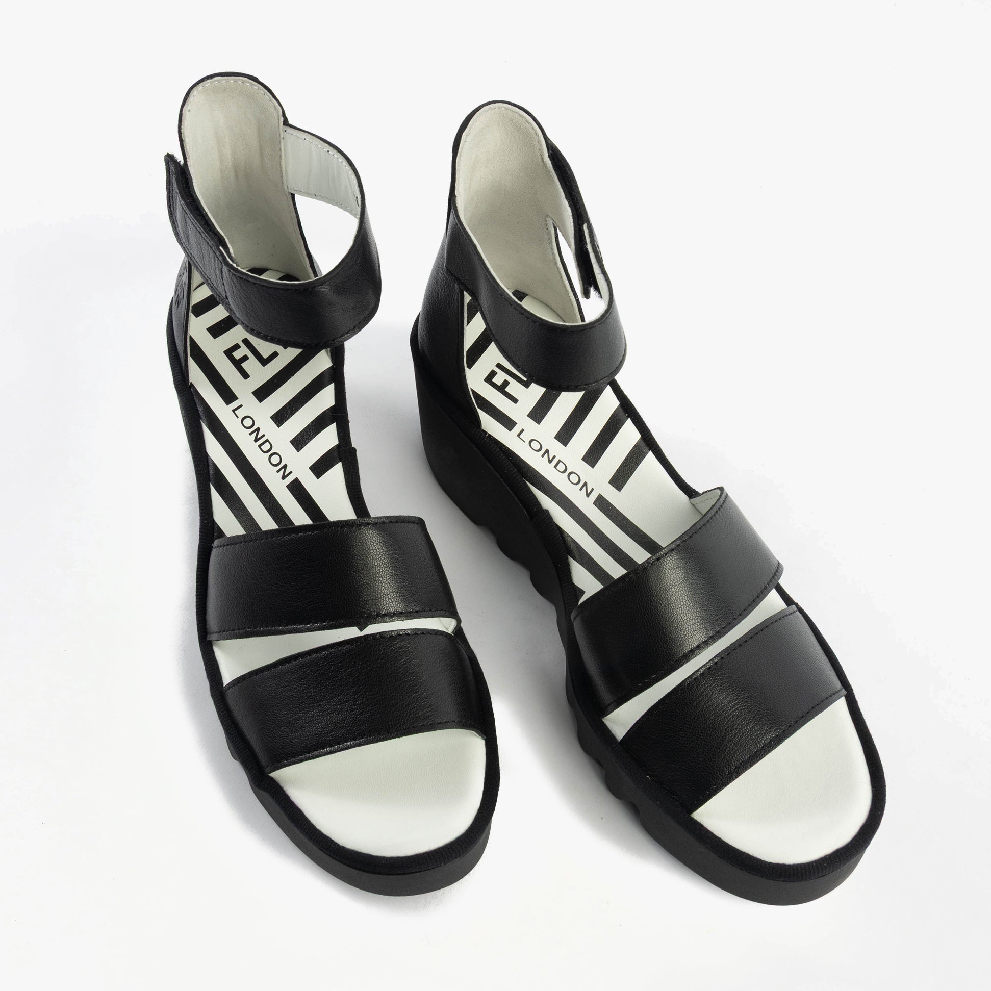 Fly London BONO290FLY Womens Sandals Black top view displaying leather straps and wedge heel.
