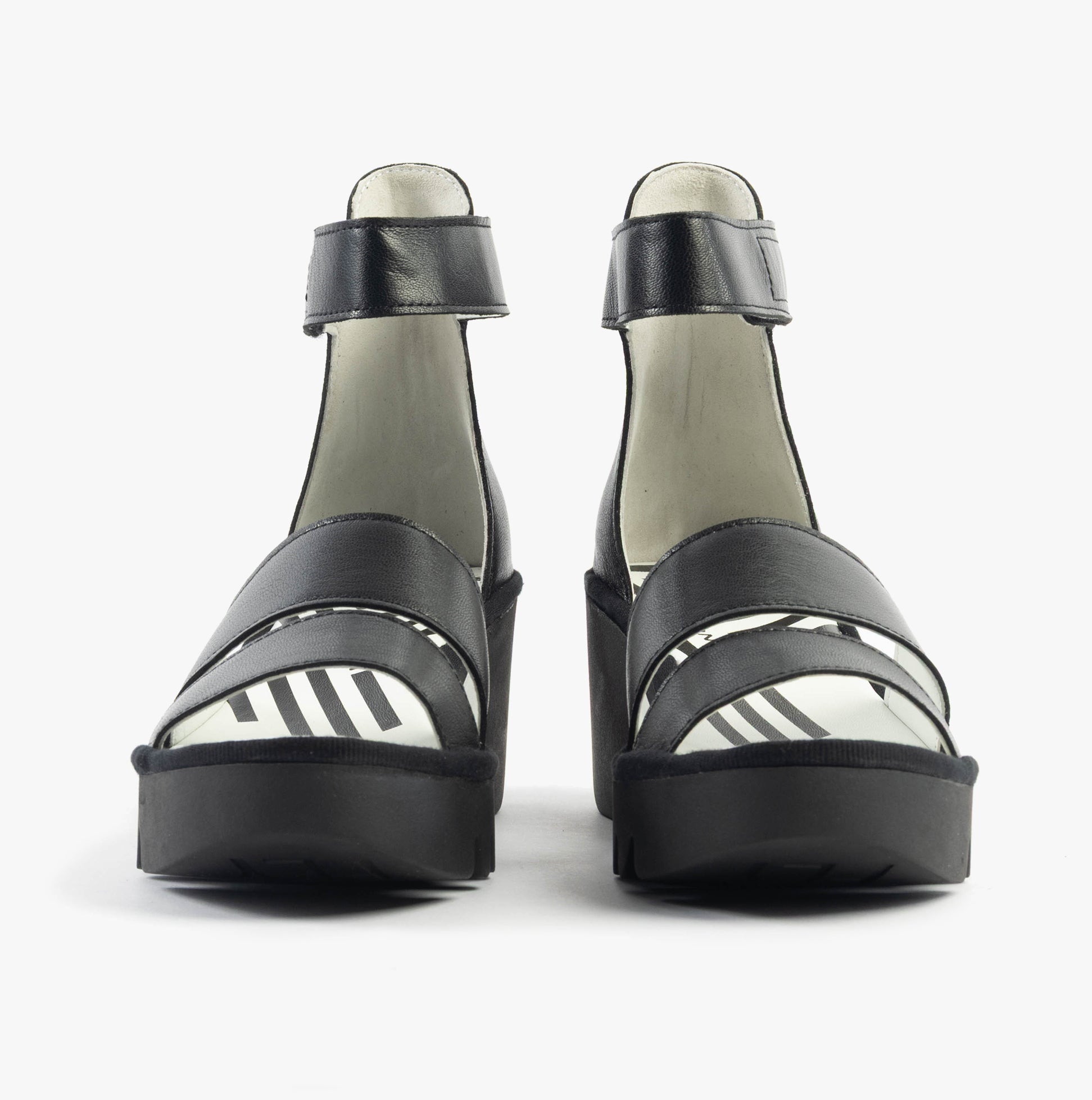 Fly London BONO290FLY Womens Sandals Black front view, showcasing the stylish leather design and wedge heel.