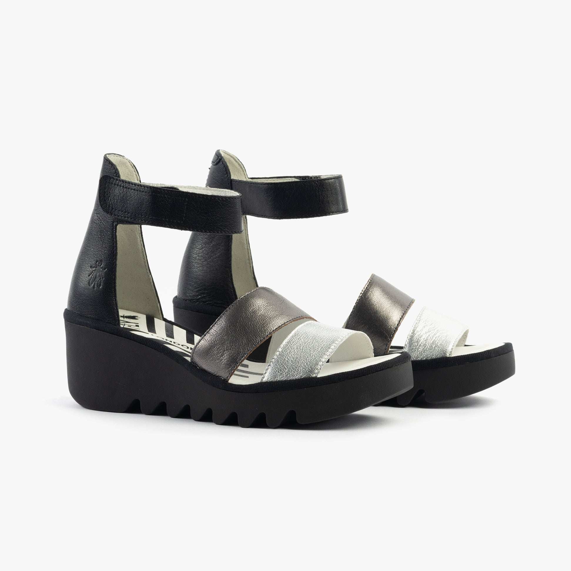 Fly London BONO290FLY Womens Sandals Silver/Graphite/Black side view showcasing leather upper and wedge heel.