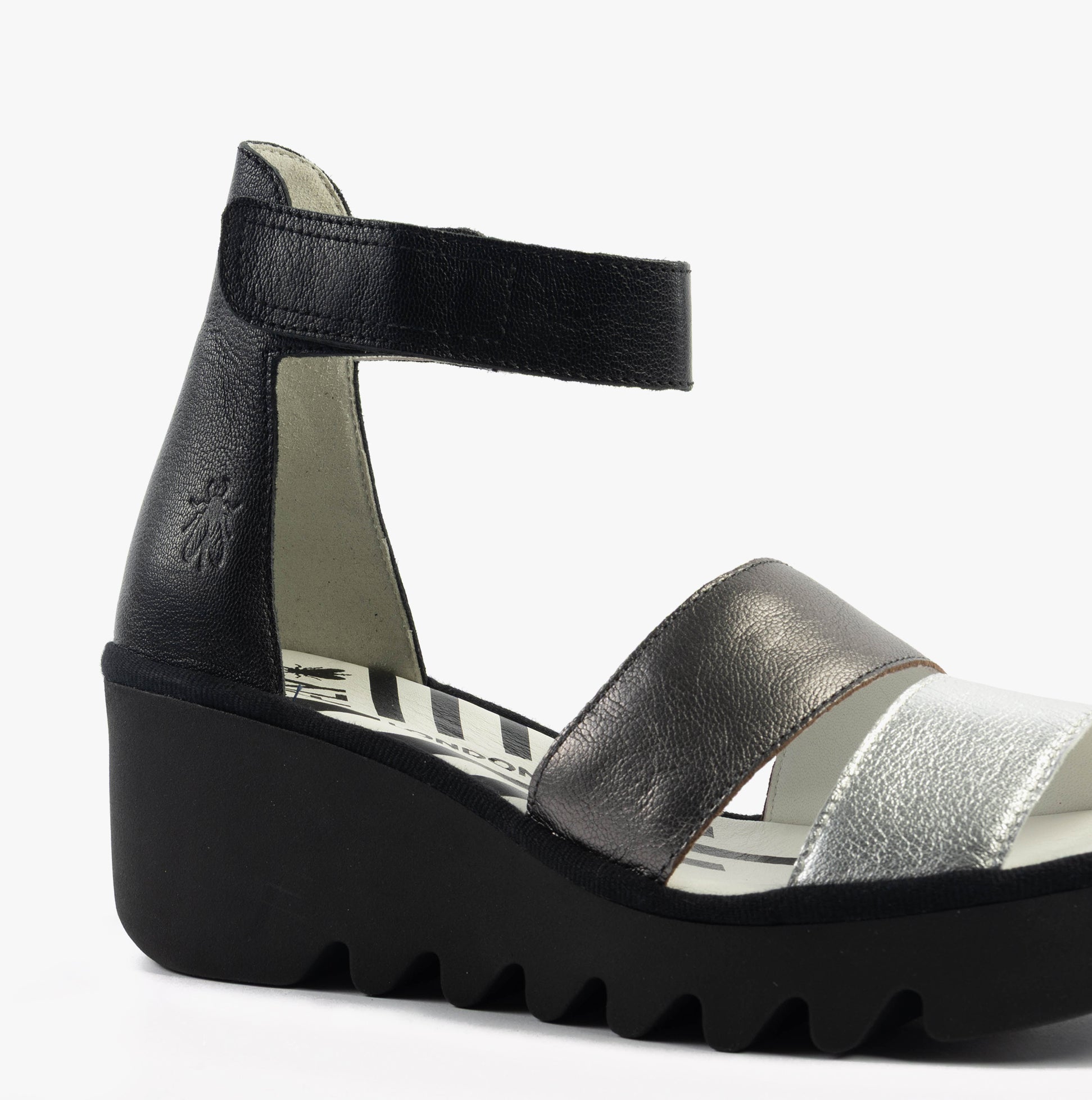 Fly London BONO290FLY Womens Sandals Silver/Graphite/Black side view showcasing the wedge heel and touch fasten closure.