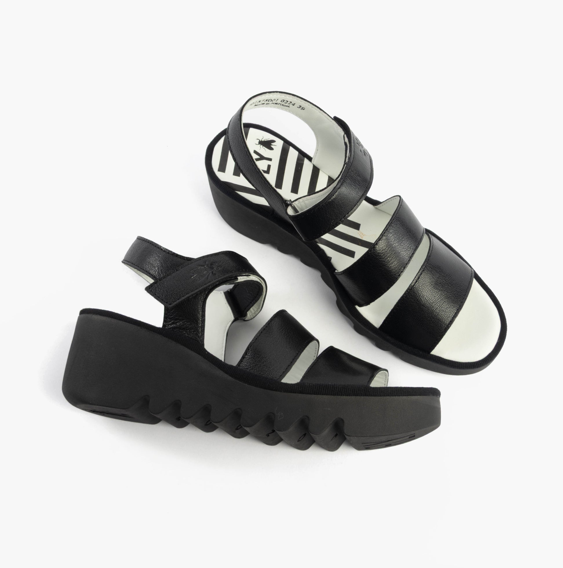 Fly London BEXY575FLY Womens Sandals Black top view showing leather straps and wedge sole design.