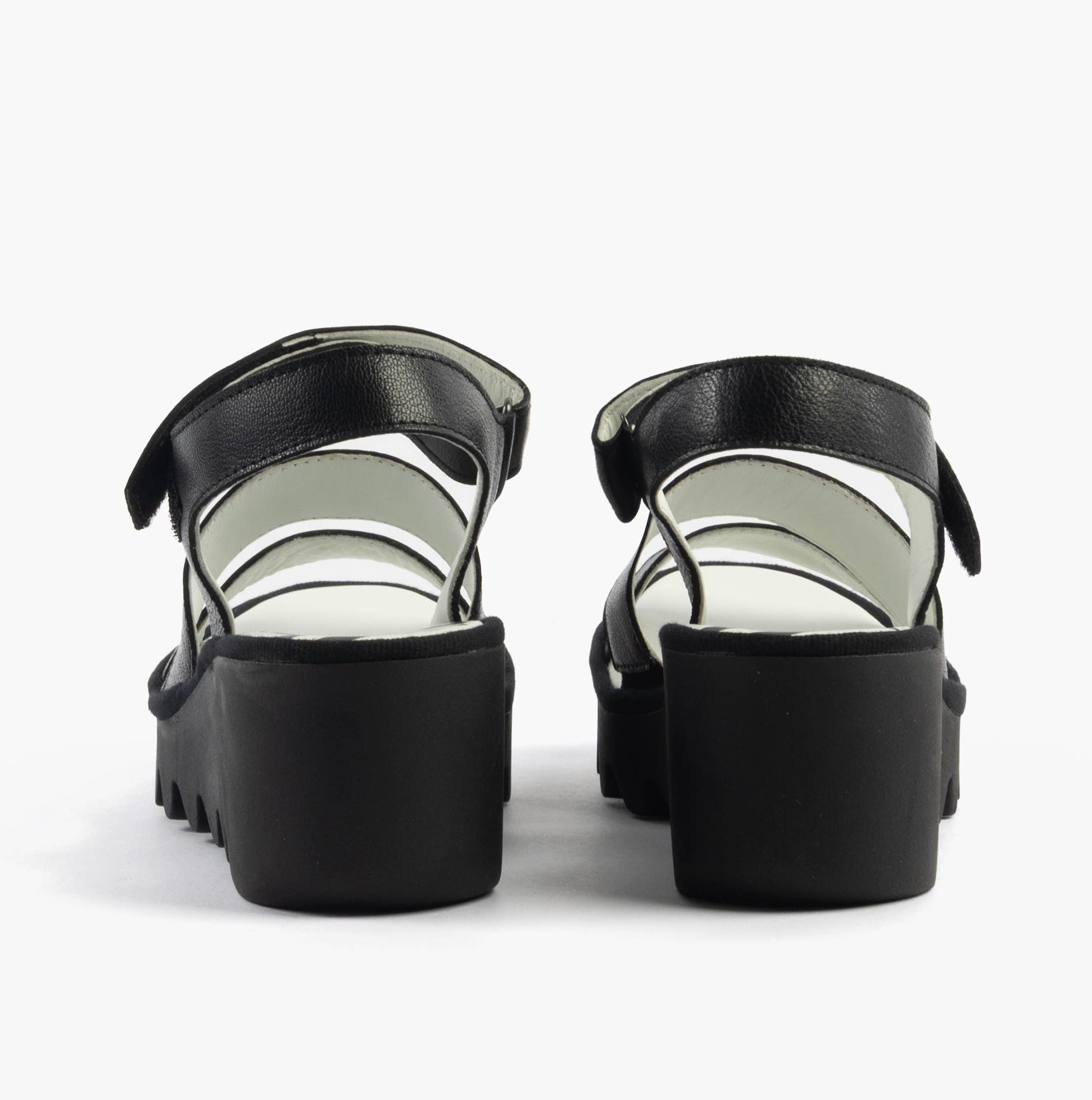 Fly London BEXY575FLY Womens Sandals Black rear view showcasing the black leather material and wedge heel design.