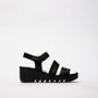 Fly London BEXY575FLY Womens Sandals Black side view, featuring leather upper, wedge heel, and touch fasten design.