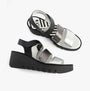 Fly London BEXY575FLY Womens Sandals Silver/Graphite/Black side view showcasing wedge heel and touch fastening.