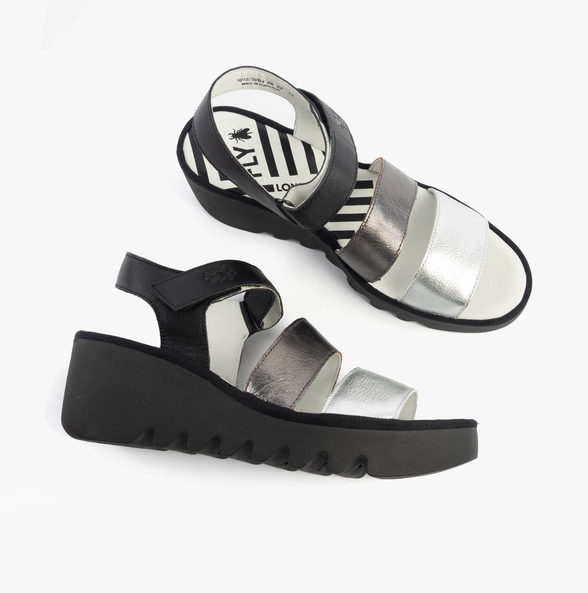 Fly London BEXY575FLY Womens Sandals Silver/Graphite/Black side view showcasing wedge heel and touch fastening.