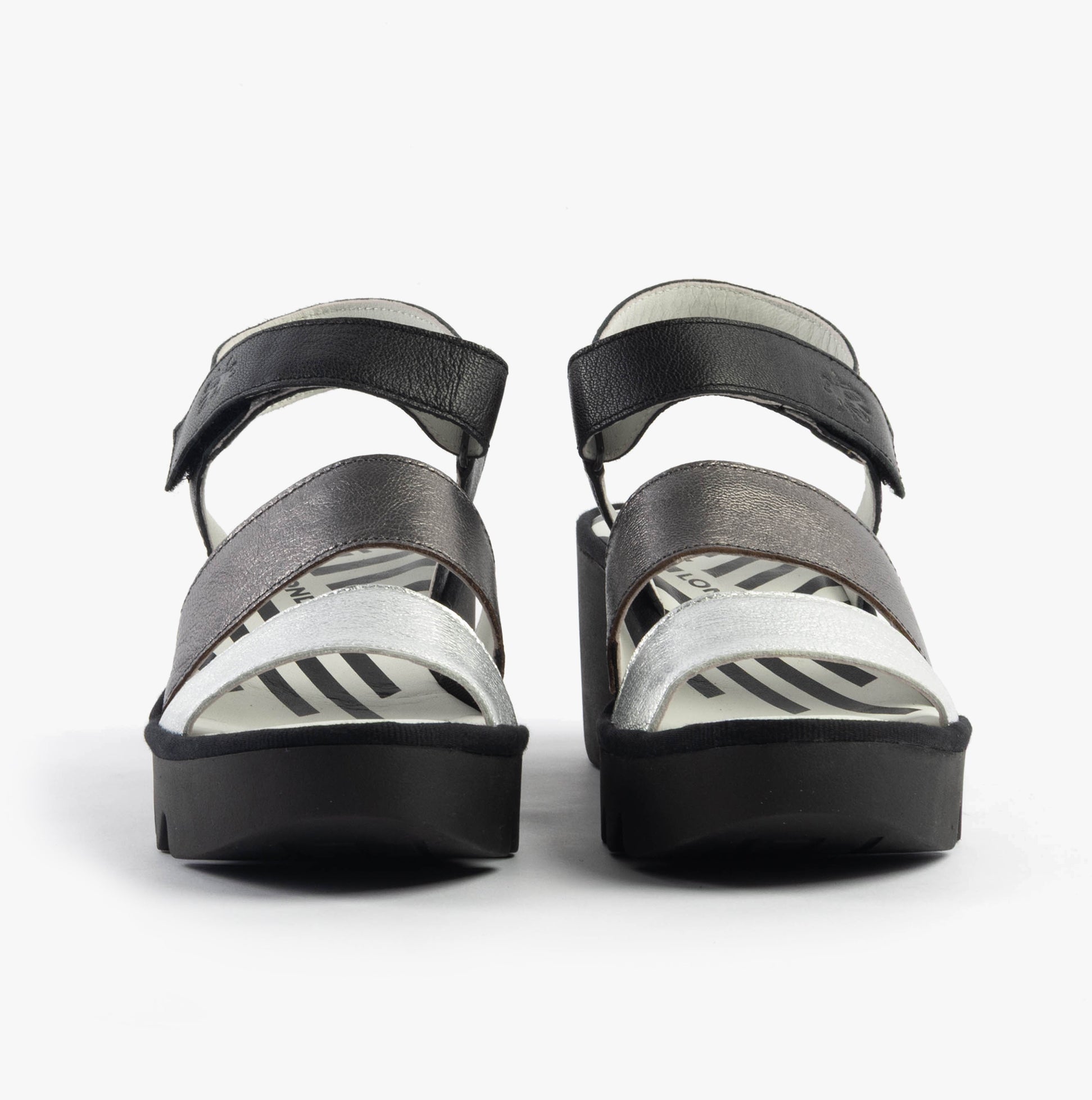 Fly London BEXY575FLY Womens Sandals Silver/Graphite/Black front view, featuring wedge heels and touch fasten closure.