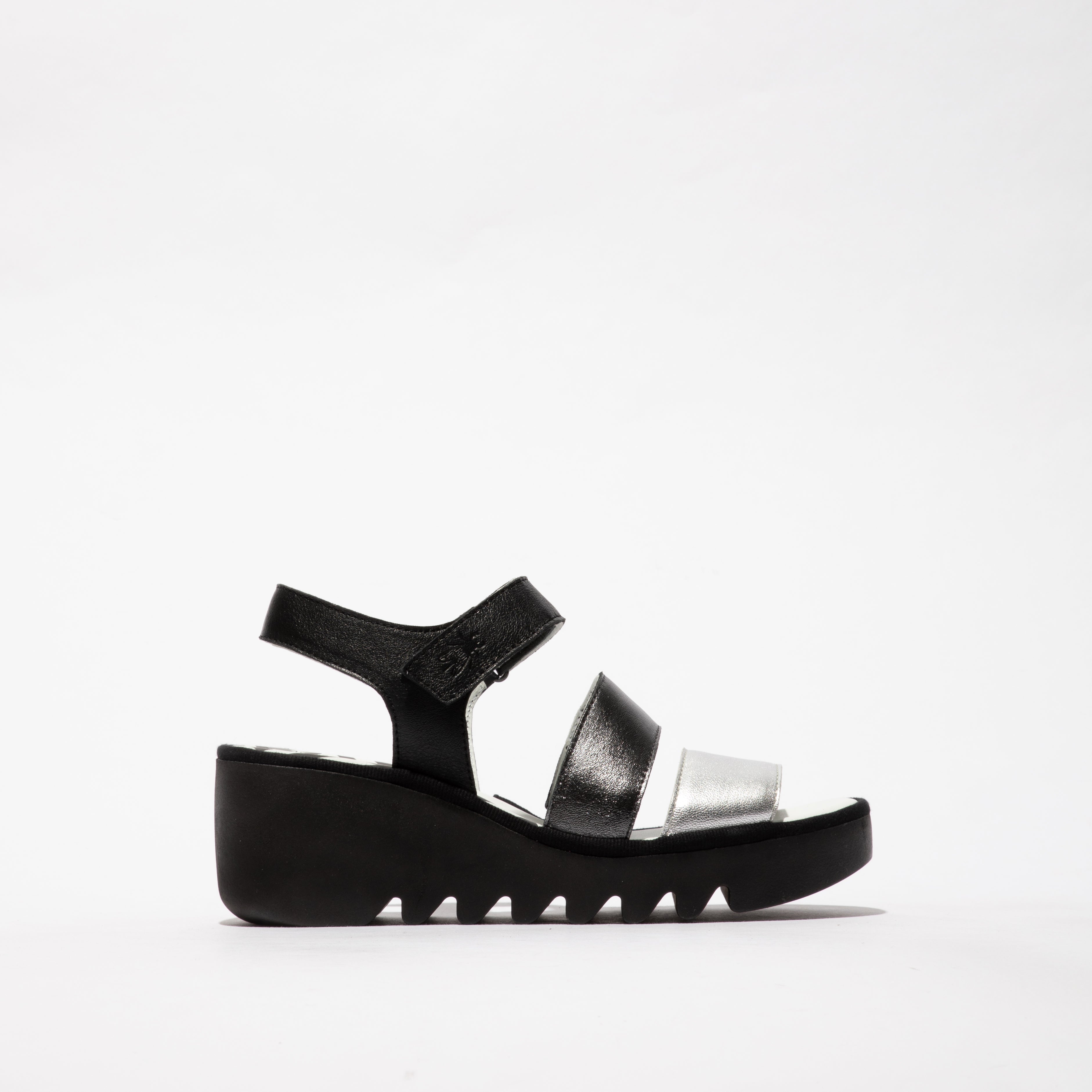 Fly London BEXY575FLY Womens Sandals Silver/Graphite/Black side view showcasing leather upper and wedge heel.