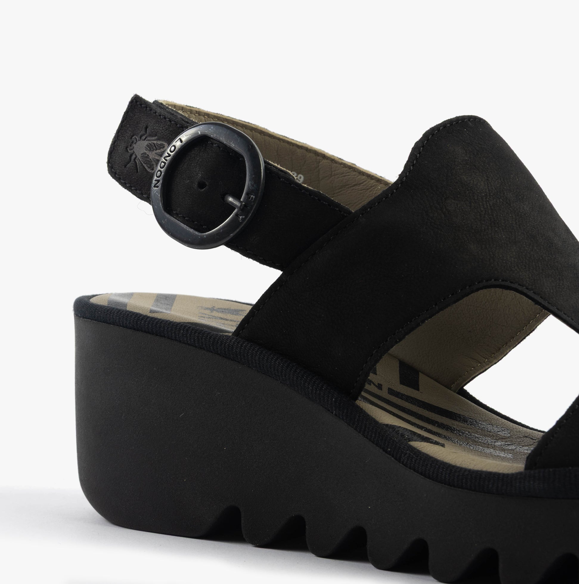 Fly London BAIF585FLY Womens Sandals Black side view showcasing the wedge heel and buckle detail.