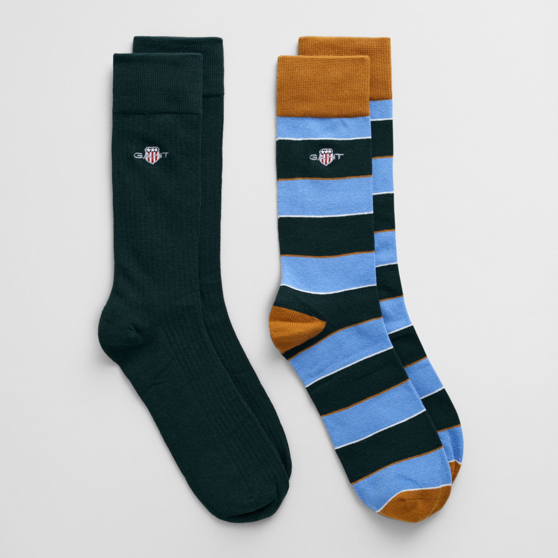GANT SHIELD RUGGER STRIPE SOCKS 2-Pack Mens Clear Sky side view showcasing one solid and one striped sock.