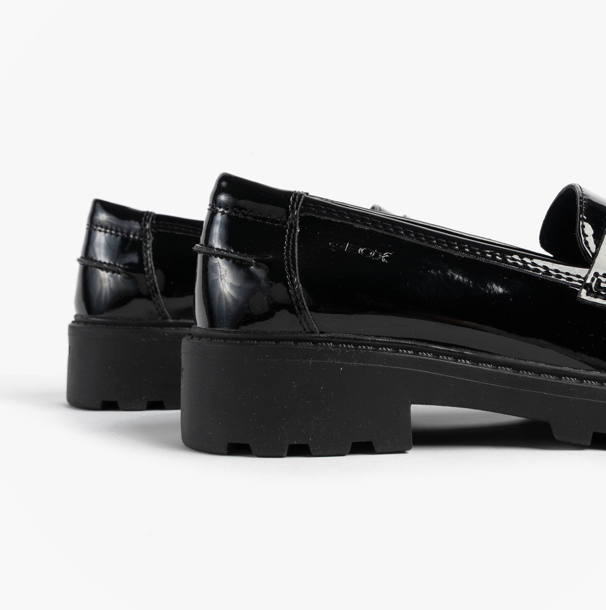 GEOX J CASEY GIRL Girls Black side view showing glossy finish and low heel of black school shoes