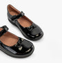 GEOX J NAIMARA Girls Shoes Black side view showing glossy upper, round toe, and touch fasten strap.