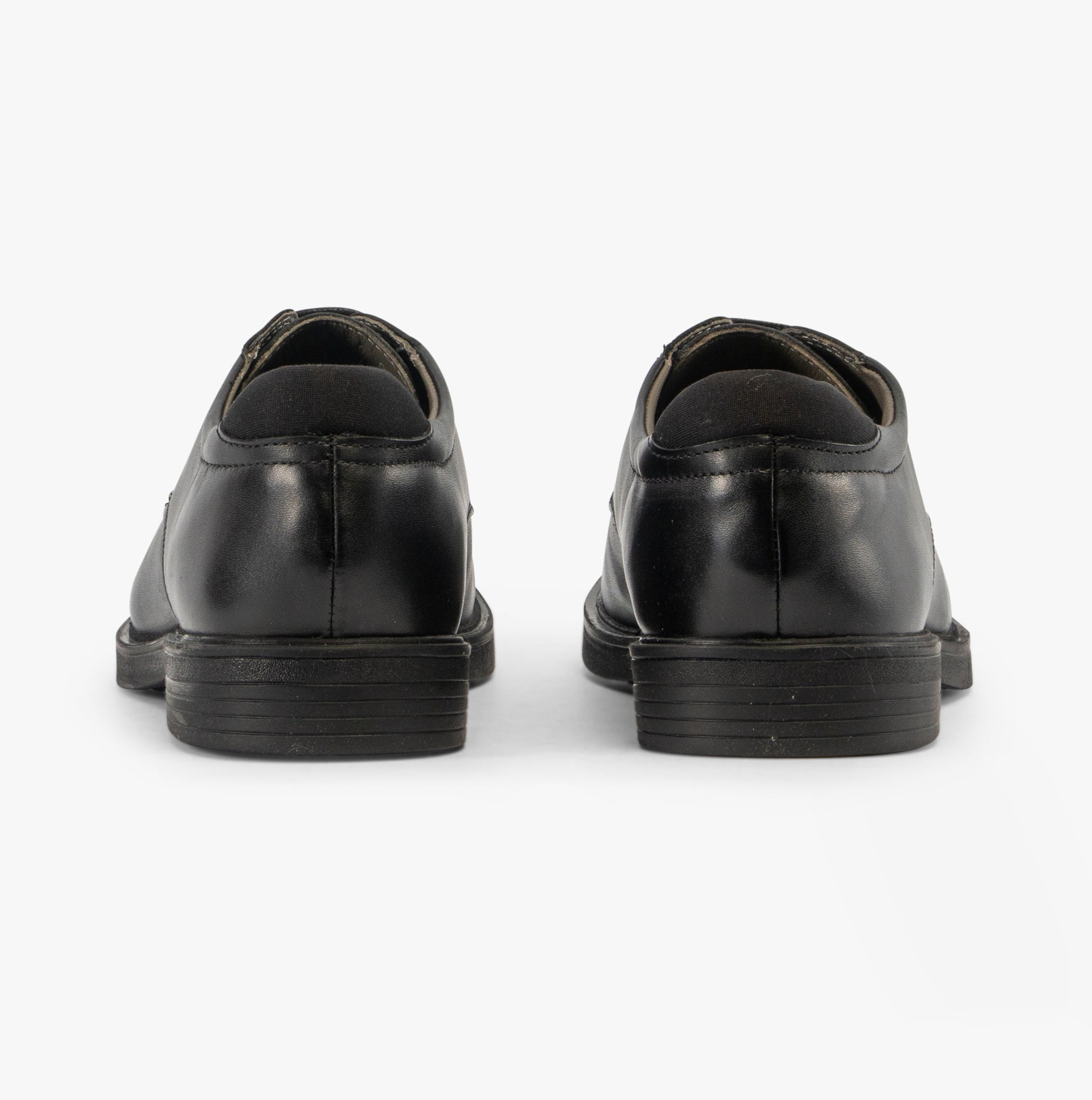 GEOX J ZHEENO Boys Shoes Black rear view, showcasing the smooth leather finish and block heel design.