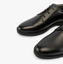 GEOX J ZHEENO Boys Shoes Black, side view showcasing the sleek leather upper and lace-up closure.