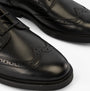 GEOX J ZHEENO Boys Shoes Black detail view showcasing black leather upper and brogue detailing.