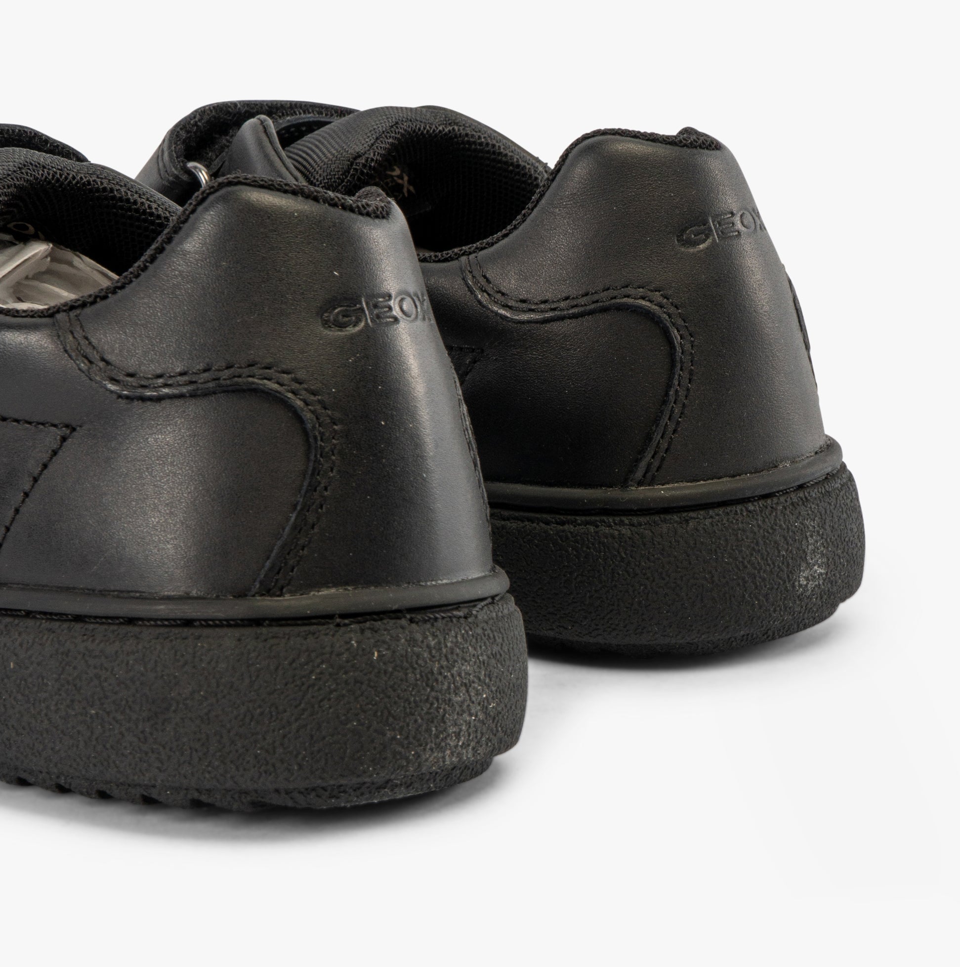 GEOX J THELEVEN Boys Trainers Black back view showing leather upper and rubber sole.